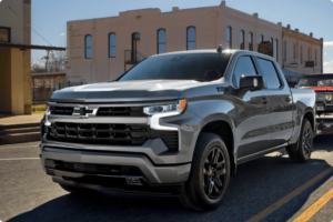 drivetrain malfunctions, auto repair, diesel repair in Killeen, TX at First Choice Automotive Repair. Chevrolet Silverado pickup truck driving through a town.