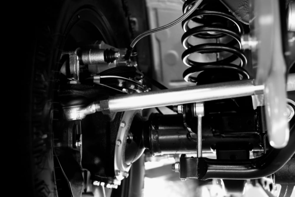 Suspension Repair in Killeen, TX At First Choice Automotive Repair. Close-up view of a vehicle suspension system at an auto repair shop.